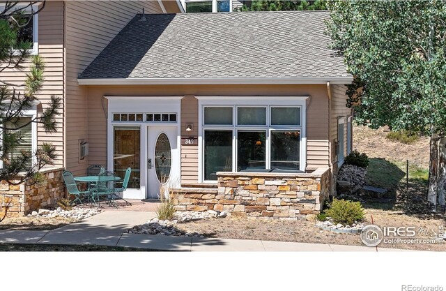 349 Overlook Ln, Estes Park, CO 80517 - view of front facade with roof with shingles and stone siding