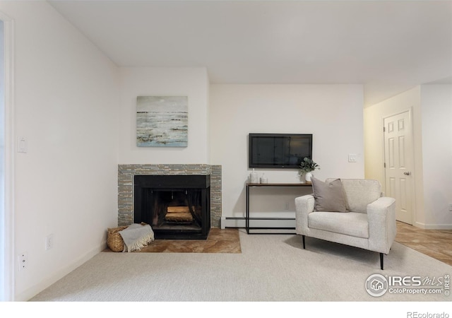 carpeted living room featuring a baseboard radiator