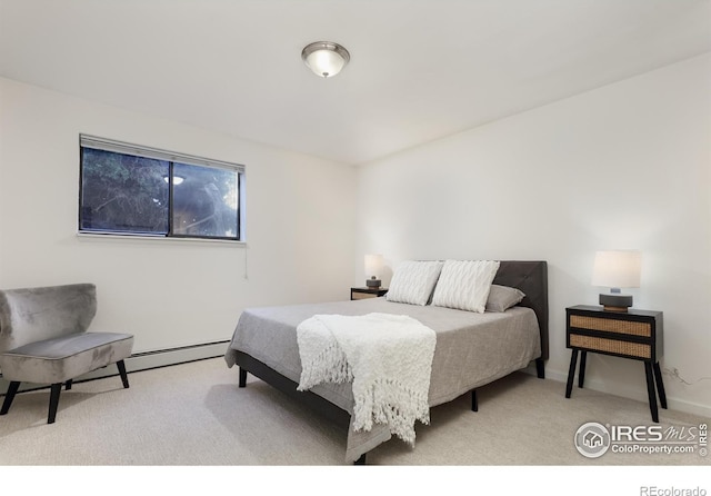 bedroom featuring a baseboard radiator and light carpet