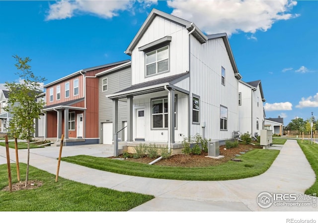 view of front of property featuring cooling unit and a front lawn