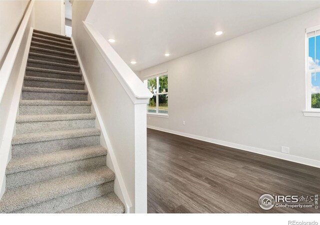 stairway featuring hardwood / wood-style flooring