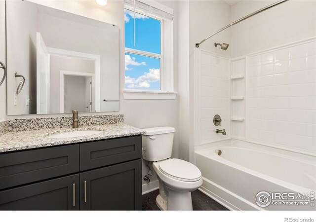 full bathroom with shower / tub combination, vanity, and toilet