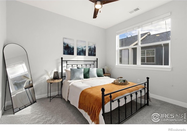 carpeted bedroom with ceiling fan