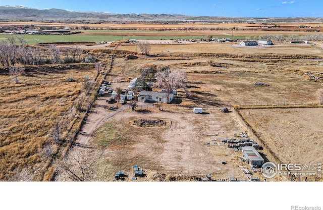 bird's eye view with a rural view and a mountain view