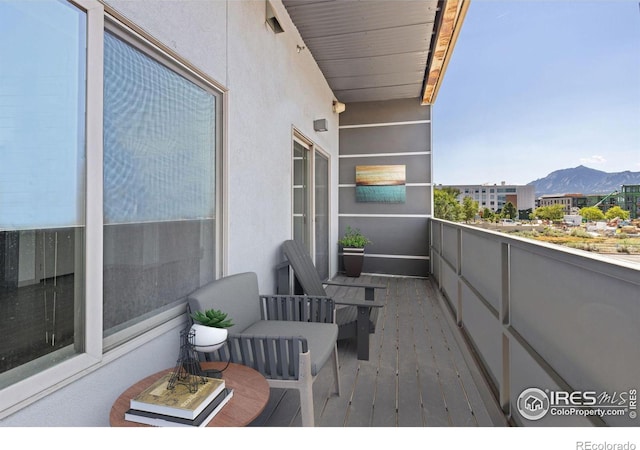 balcony featuring a mountain view