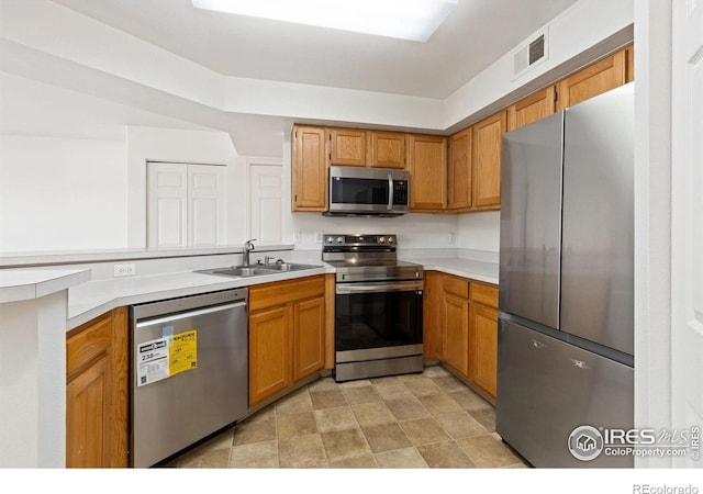 kitchen with appliances with stainless steel finishes and sink