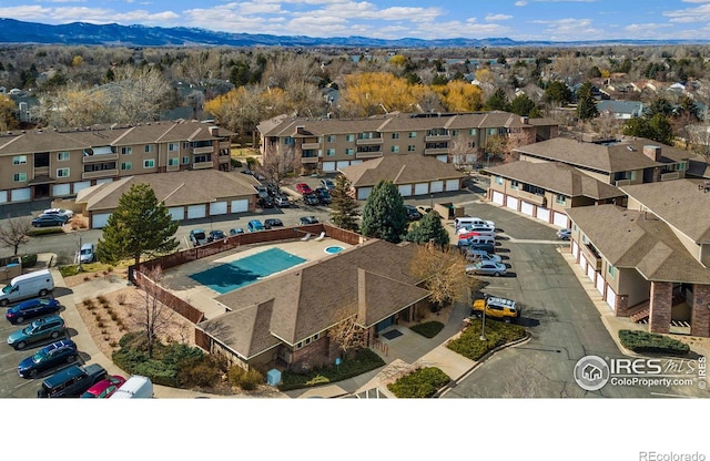 birds eye view of property with a mountain view