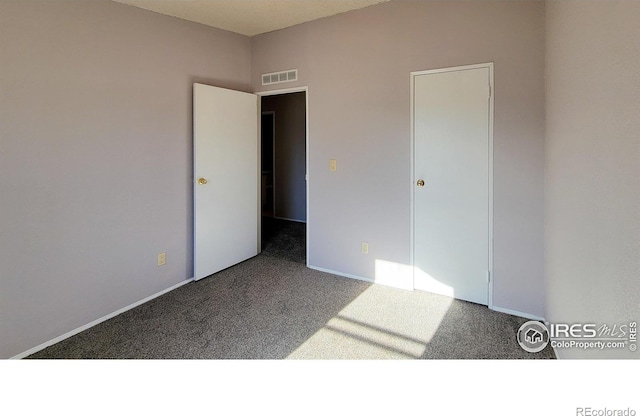 unfurnished bedroom with carpet floors