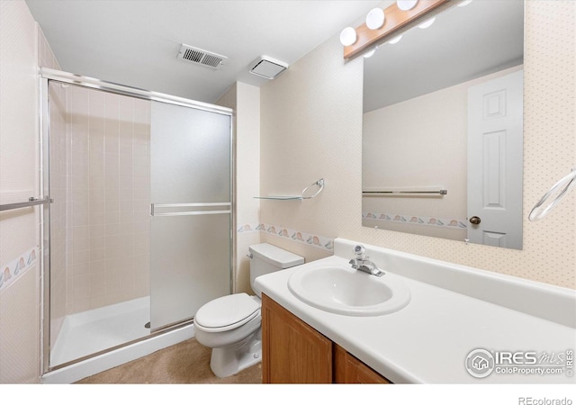 full bathroom with a stall shower, visible vents, vanity, and toilet