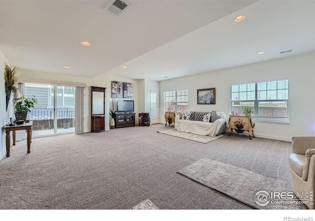 living room featuring light carpet