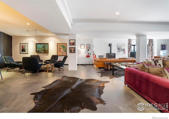 living room featuring a wood stove