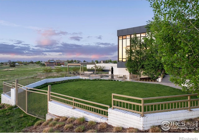 yard at dusk with a patio