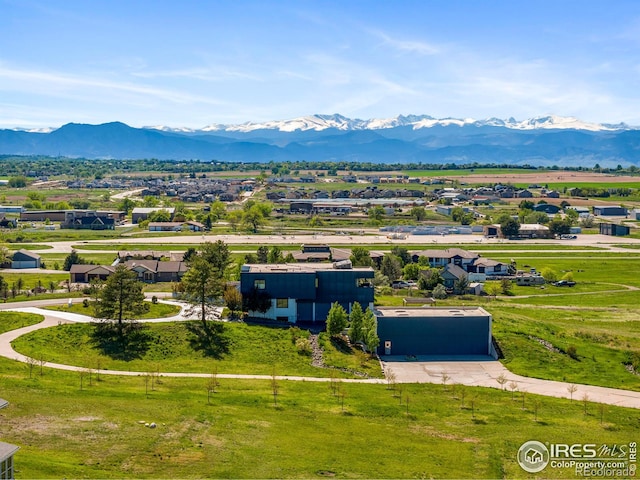 birds eye view of property featuring a mountain view