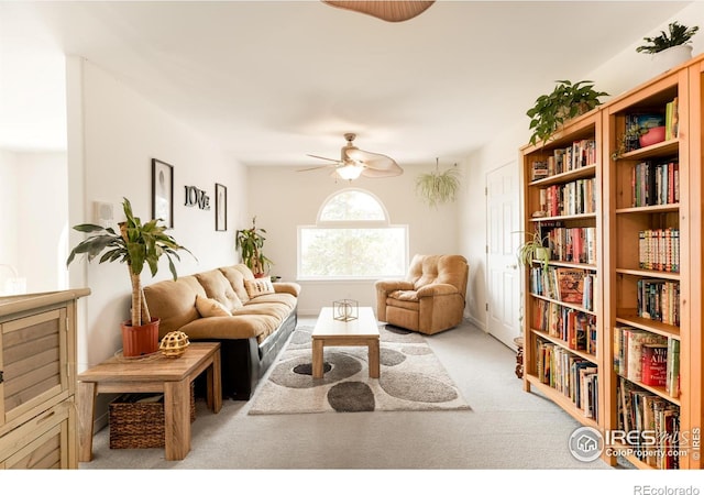 sitting room with light carpet and ceiling fan