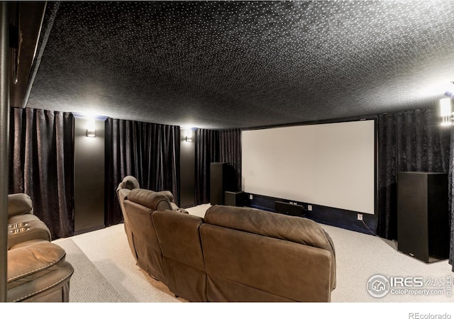 carpeted home theater featuring a textured ceiling