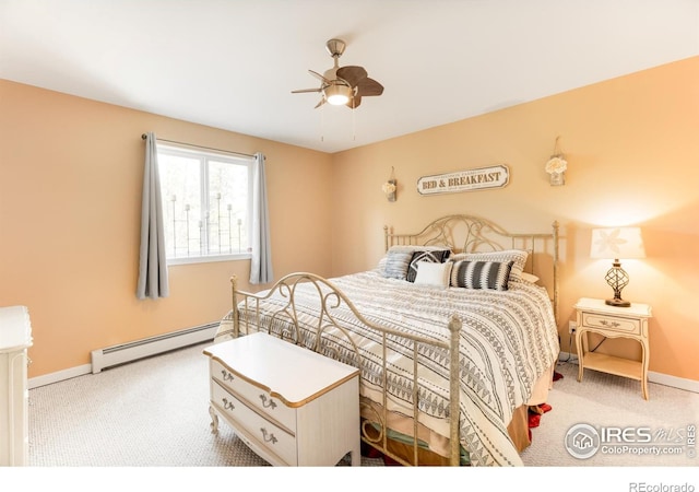 carpeted bedroom featuring ceiling fan and baseboard heating