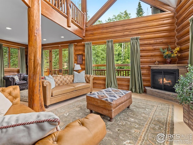 living room with rustic walls and high vaulted ceiling