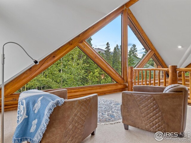 sunroom featuring vaulted ceiling
