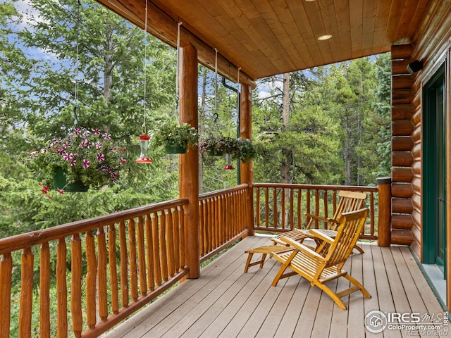 wooden terrace featuring a porch