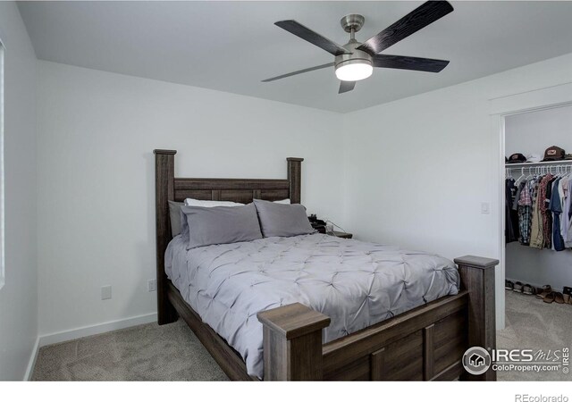 carpeted bedroom with a closet and ceiling fan