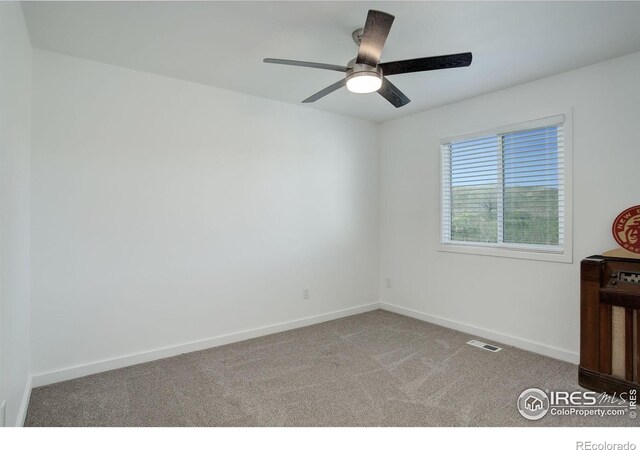 carpeted empty room with ceiling fan