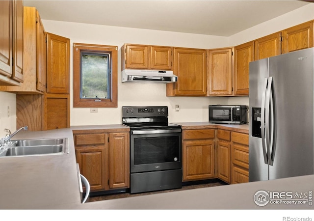 kitchen with appliances with stainless steel finishes and sink