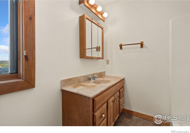 bathroom with tile patterned flooring and vanity