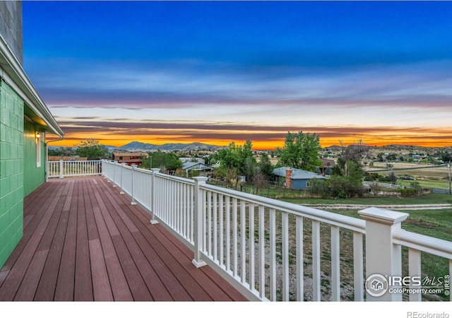 deck at dusk with a mountain view