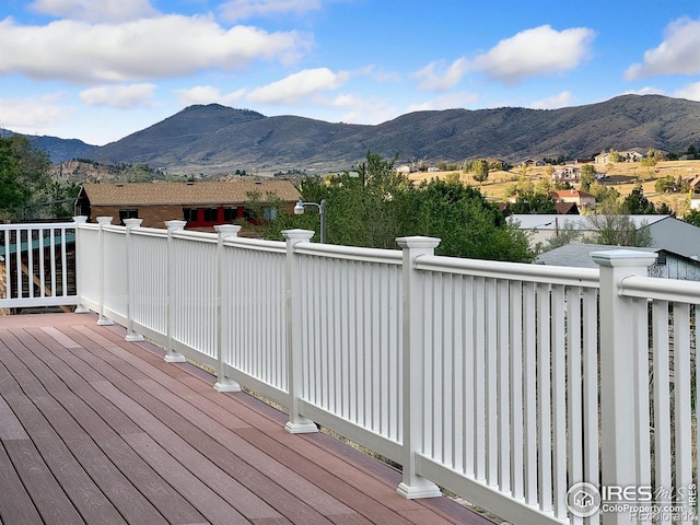 wooden deck with a mountain view