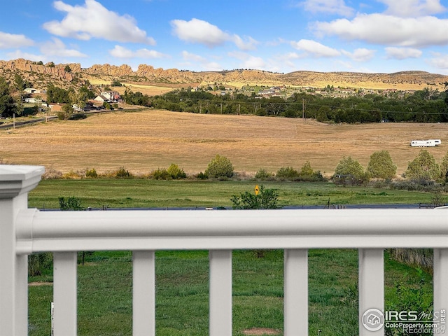 exterior space with a rural view and a mountain view