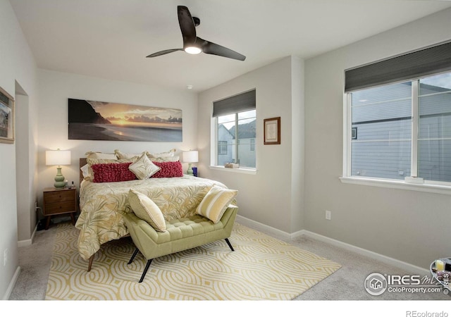 carpeted bedroom with ceiling fan