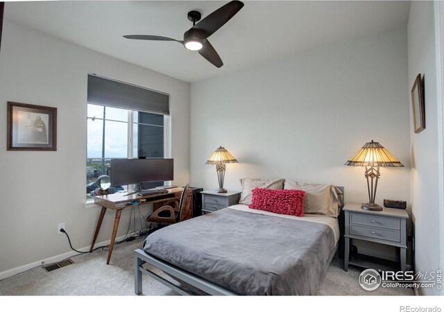 carpeted bedroom with ceiling fan