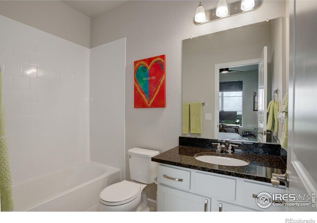 full bathroom with vanity, toilet, ceiling fan, and bathing tub / shower combination