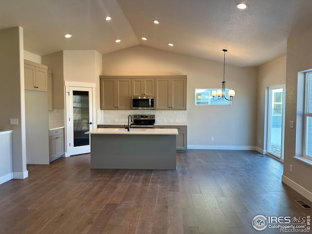 kitchen with dark hardwood / wood-style floors, hanging light fixtures, appliances with stainless steel finishes, and gray cabinetry