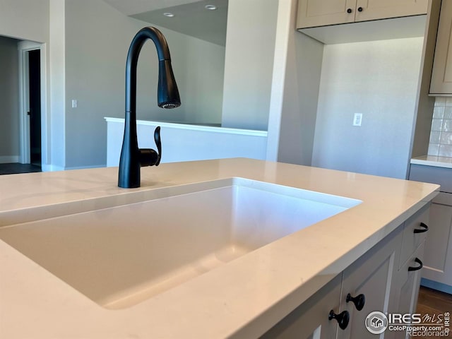 room details with sink and decorative backsplash