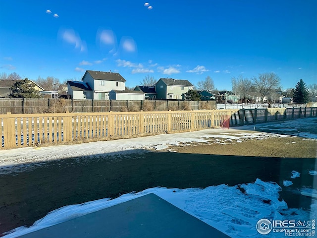 view of yard covered in snow