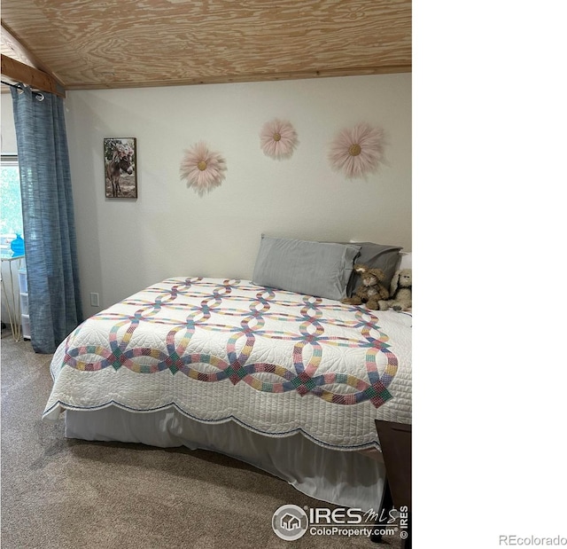 carpeted bedroom with wooden ceiling