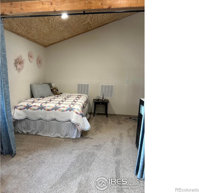 carpeted bedroom featuring visible vents