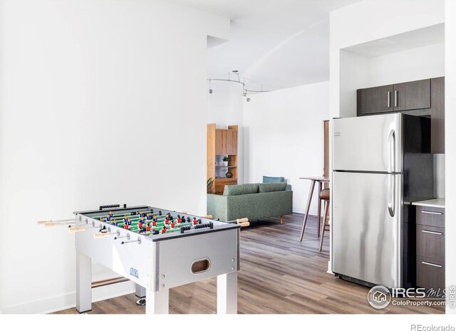 playroom with light hardwood / wood-style flooring