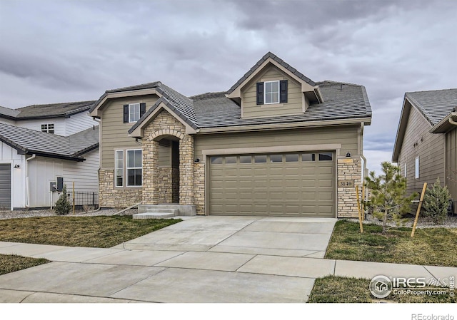 3140 Newfound Lake Rd, Berthoud, CO 80513 - view of front of home with stone siding and concrete driveway