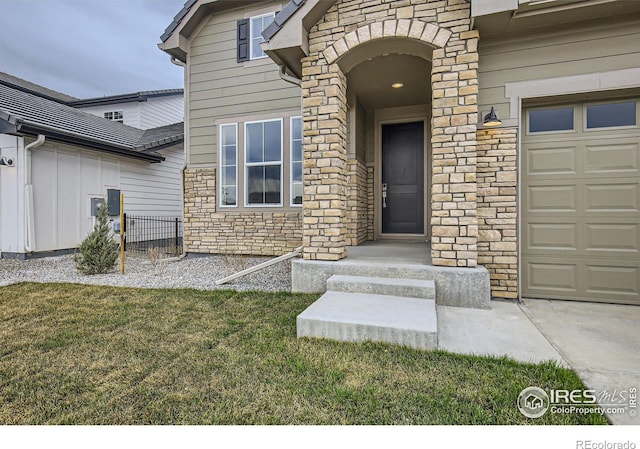 3140 Newfound Lake Rd, Berthoud, CO 80513 - view of exterior entry with stone siding and a lawn