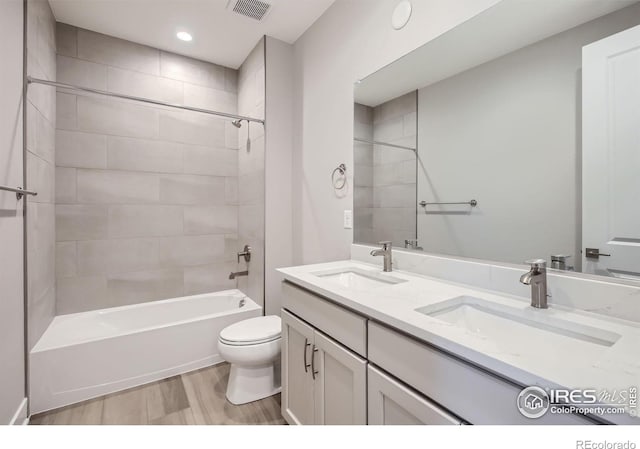 3140 Newfound Lake Rd, Berthoud, CO 80513 - full bathroom featuring toilet, a sink, wood finished floors, and visible vents
