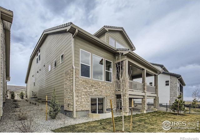 3140 Newfound Lake Rd, Berthoud, CO 80513 - exterior space with stone siding and fence