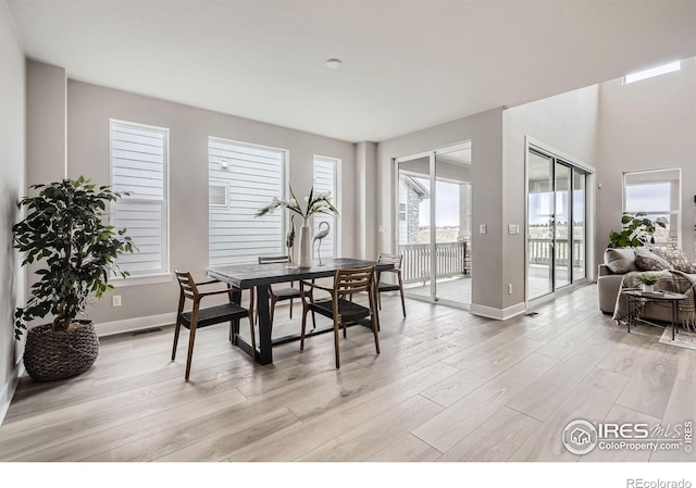 3140 Newfound Lake Rd, Berthoud, CO 80513 - dining room with baseboards, visible vents, and light wood-style flooring