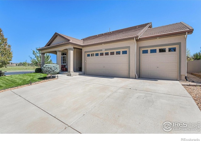 view of front of property with a garage