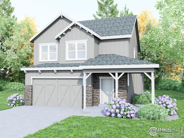 view of front of home with a garage and a front yard