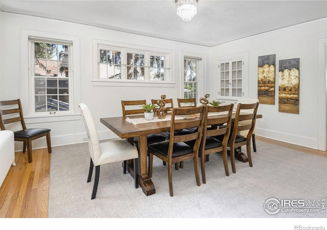 dining space with light hardwood / wood-style flooring