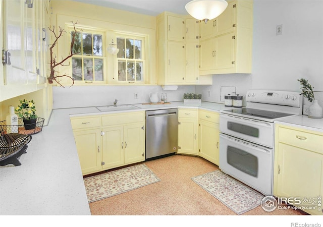 kitchen with dishwasher, sink, and white electric stove