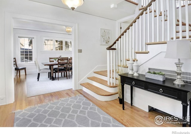 entryway with light hardwood / wood-style floors