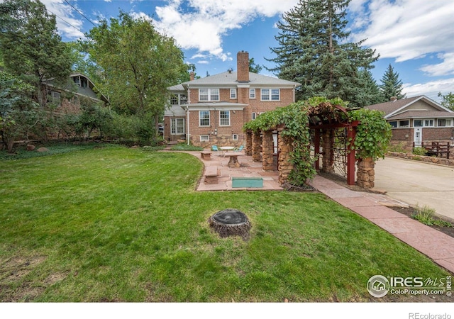 exterior space featuring an outdoor fire pit